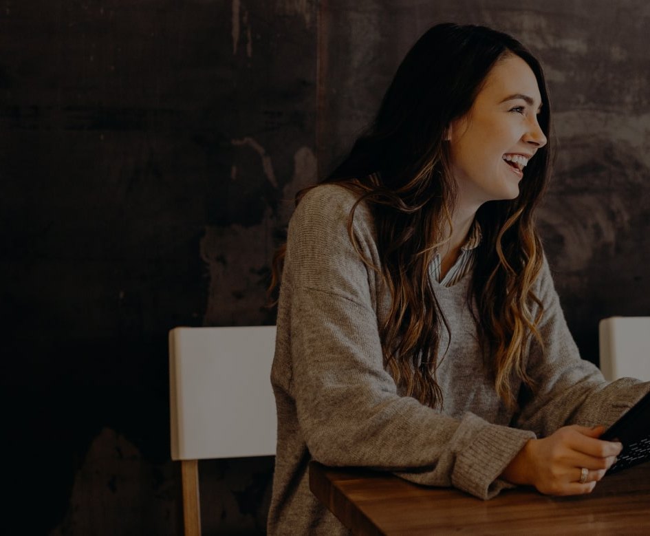 A woman is happily smiling