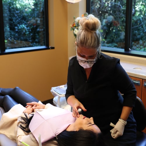 Issaquah dentist with a patient in a dental chair