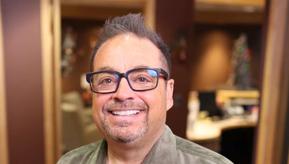 Dr. Ron Sherman smiling inside dental office First Impressions Dental Care