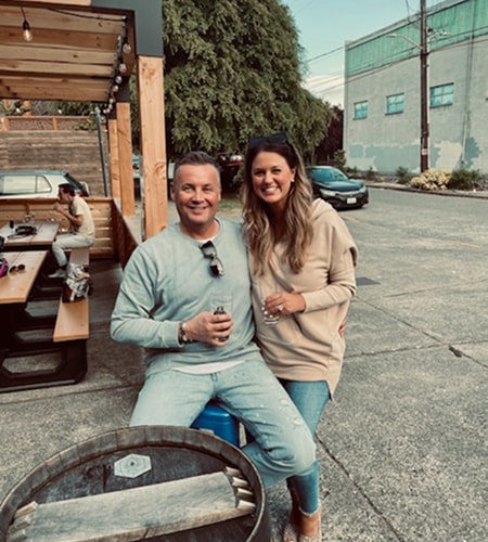 Makell is smiling with a friend